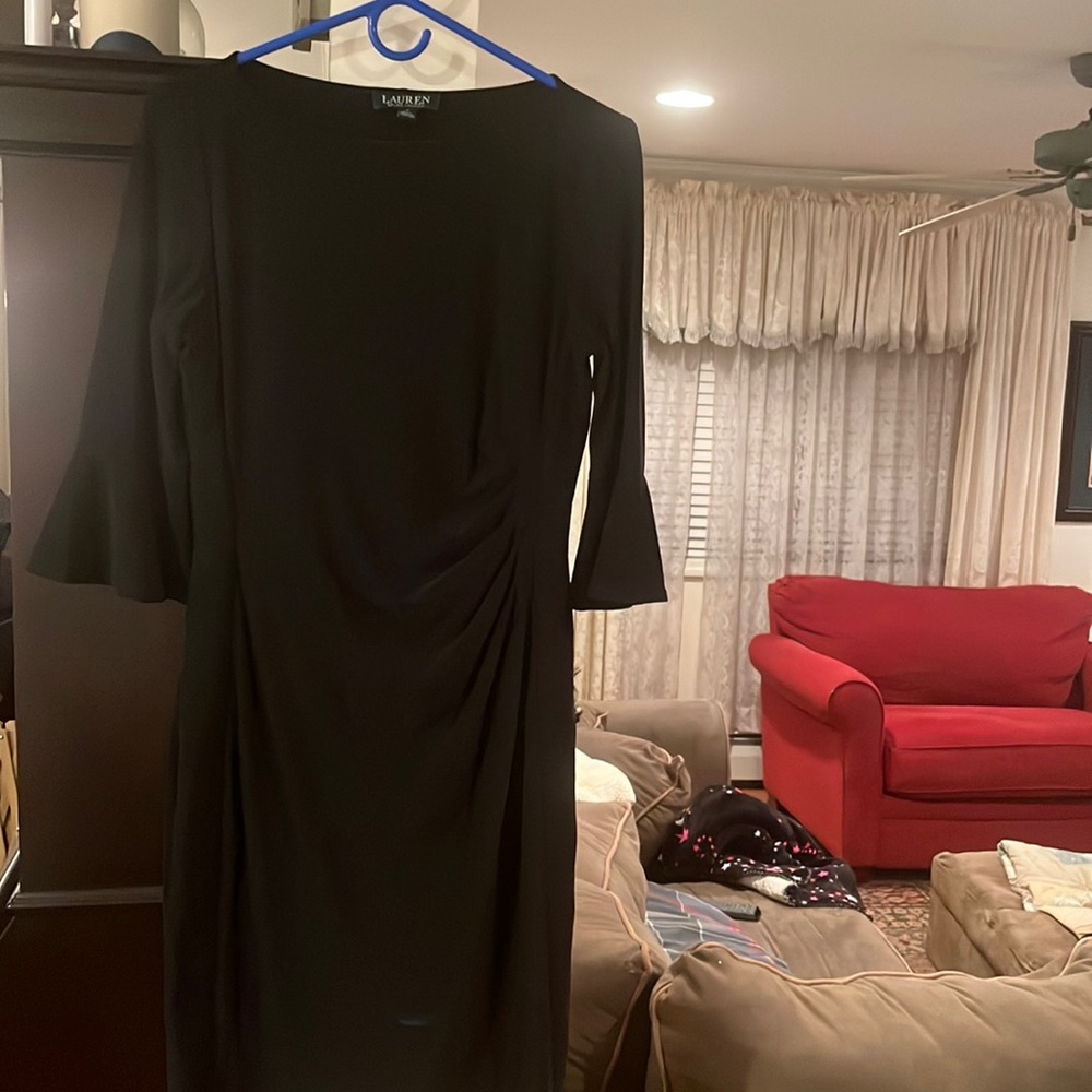 A closet staple! A classic Black dress with flattering ruching, flutter sleeves